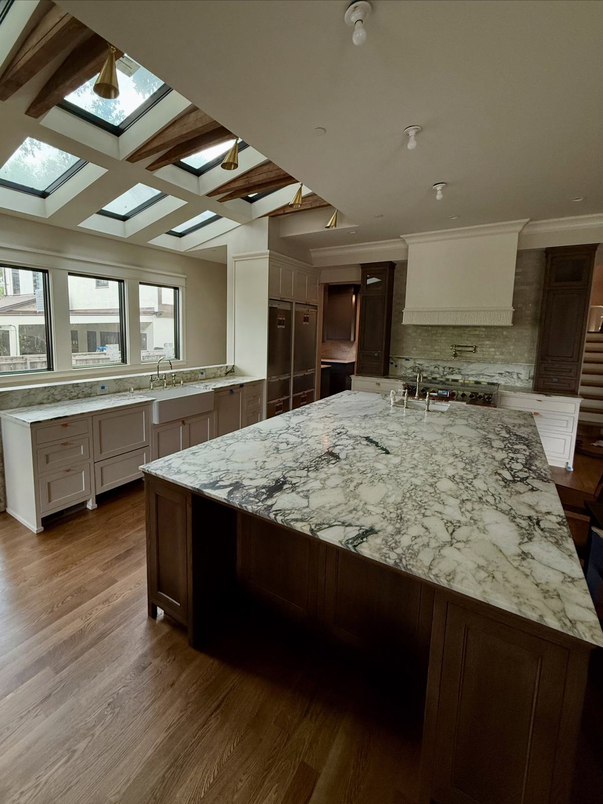 Kitchen with skylights and beamed ceiling